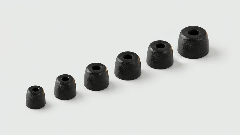 Six black ear tips arranged by size