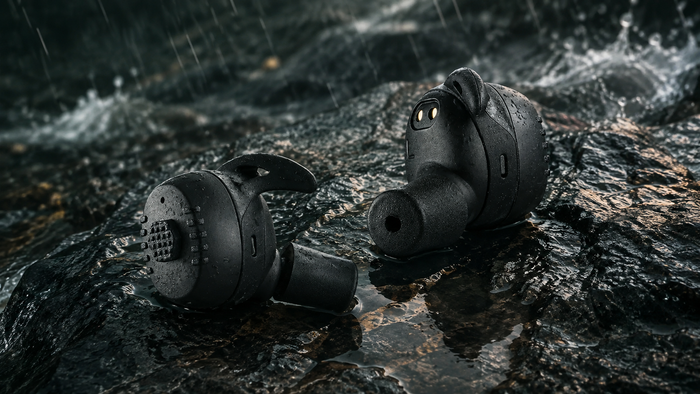 Field Signal Pro earbuds on wet rock