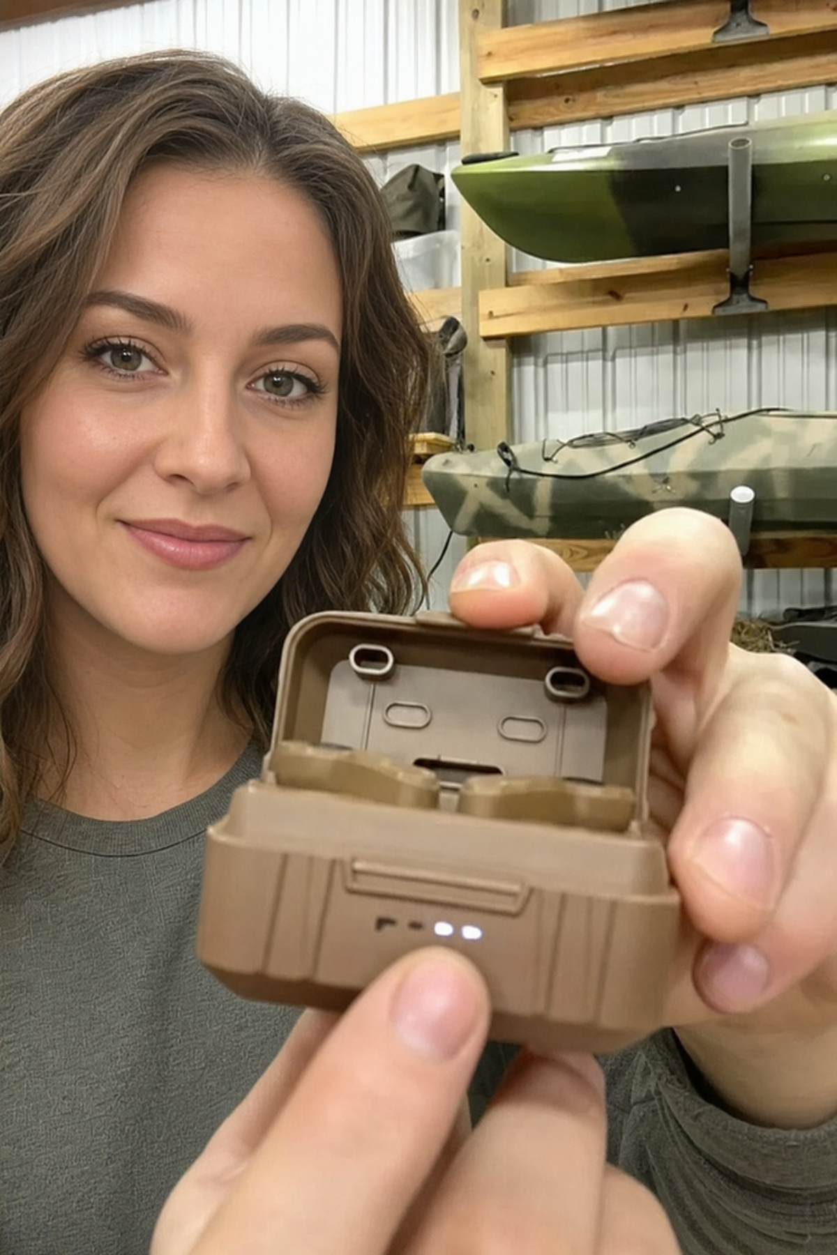 Customer holding an open Field Signal charging case