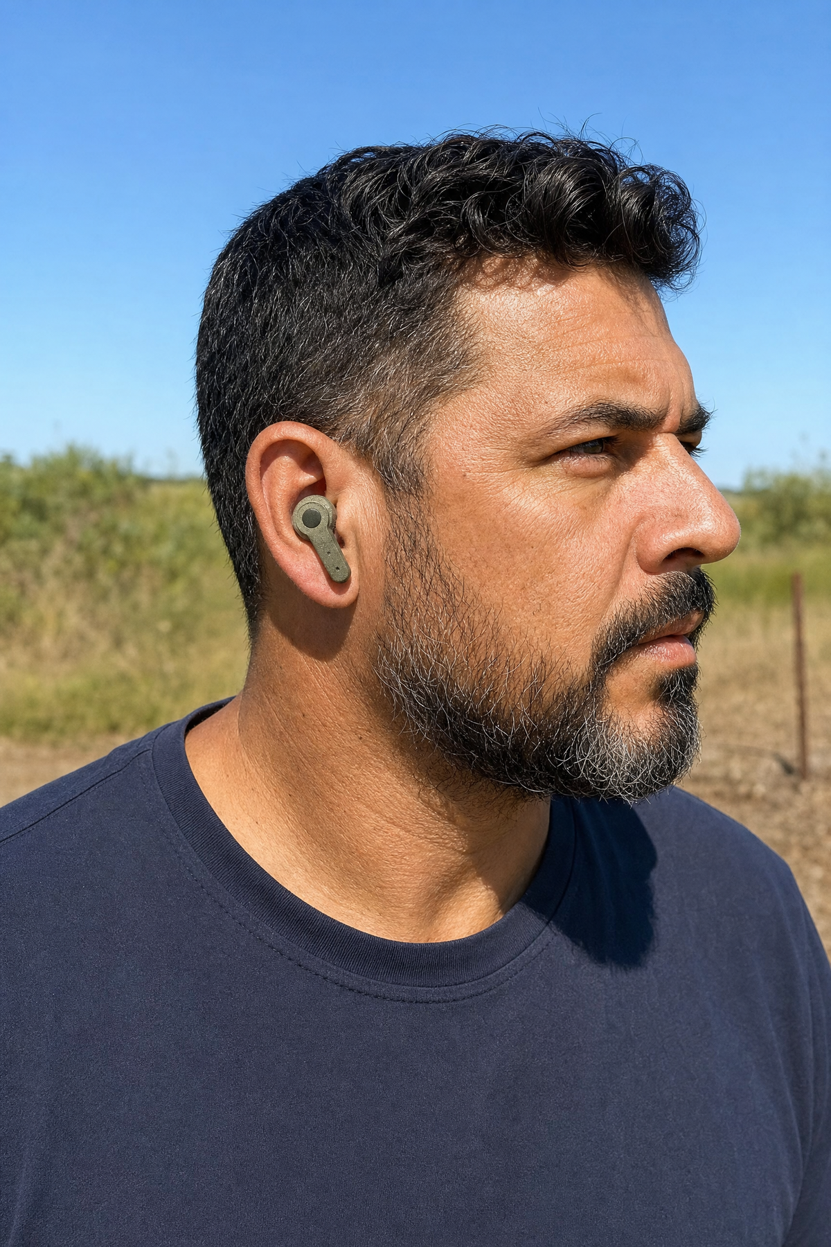 Customer wearing a Field Signal earbud outdoors